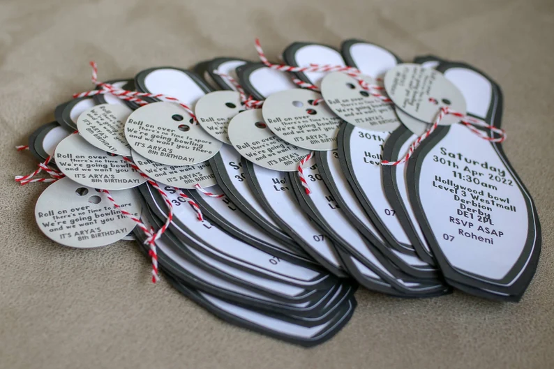 Mixed media bowling party invite, skittle shape with hanging bowling ball